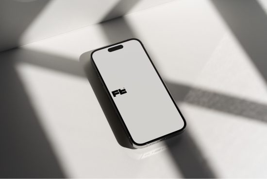 Smartphone mockup on white surface with dynamic shadows, modern design presentation, digital asset for app showcase, mobile UI/UX display.